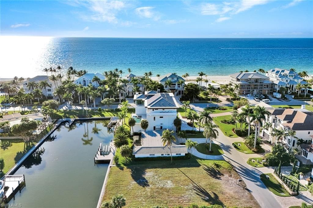 Aerial perspective of suburban area with a nearby body of water