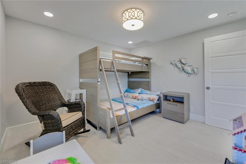 Bedroom featuring light wood-type flooring and recessed lighting