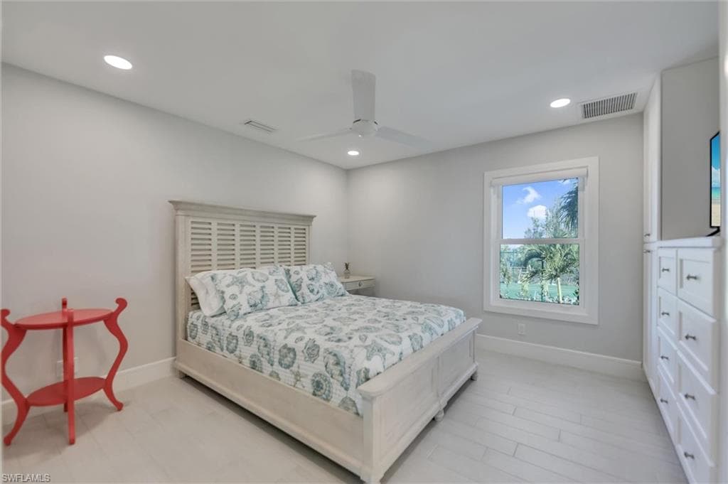 Bedroom with recessed lighting and a ceiling fan