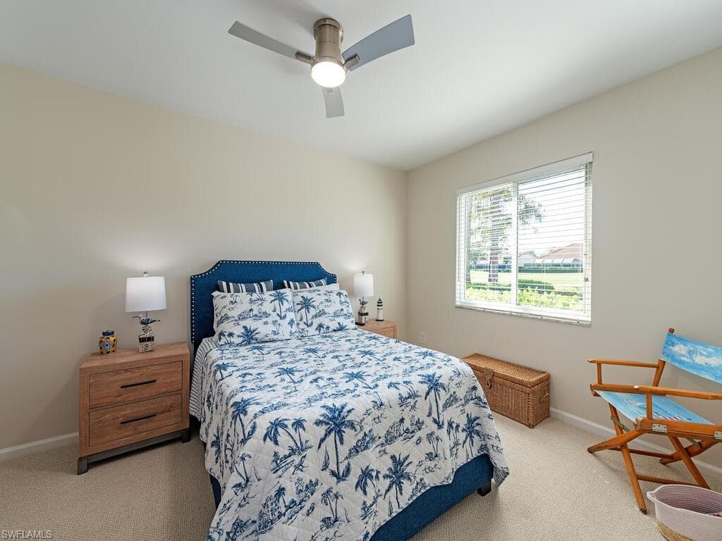 Bedroom featuring light carpet and ceiling fan