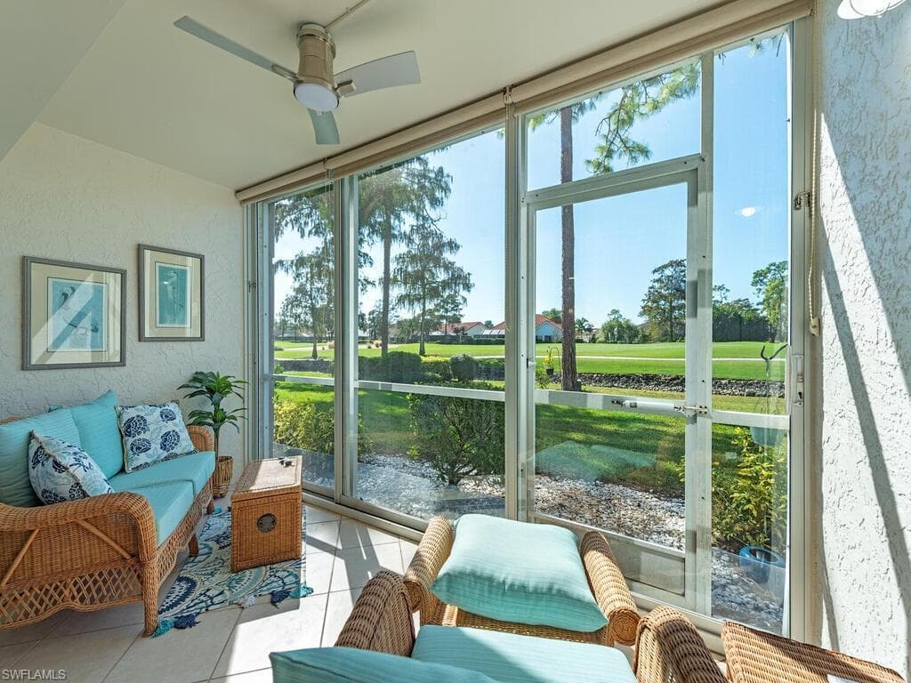 Sunroom with a ceiling fan and outdoor lounge area