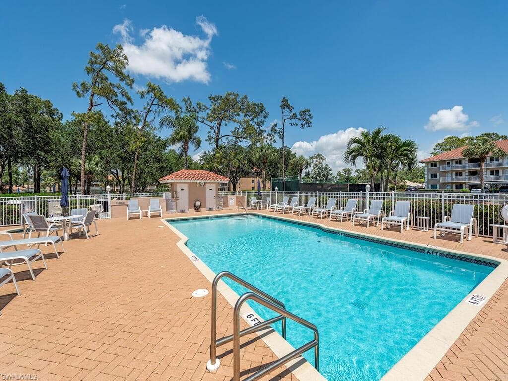 Community pool with a patio