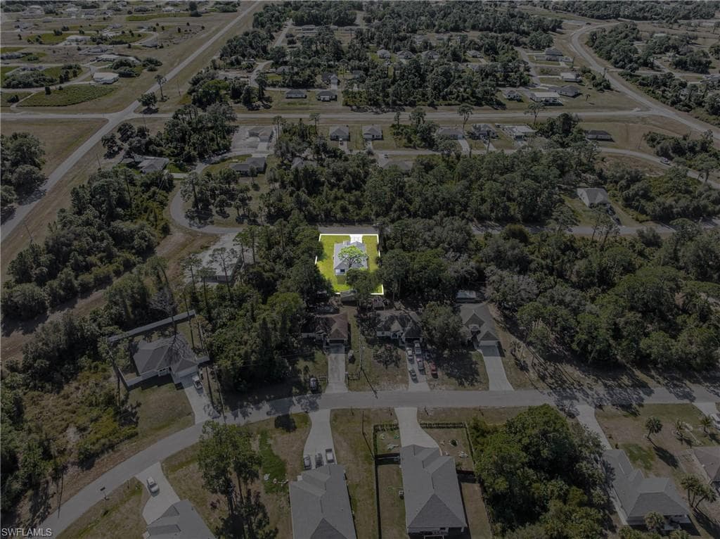 Aerial overview of property's location with nearby suburban area