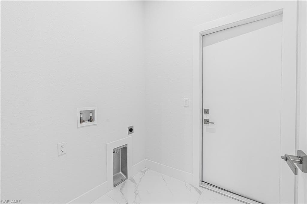 Laundry room with marble finish flooring, hookup for an electric dryer, and hookup for a washing machine