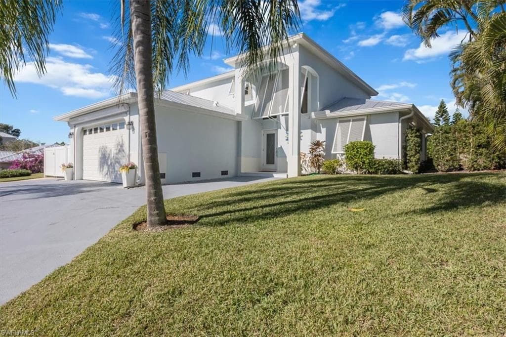 Turnkey furnished 4+ bedroom home on .25 acre lot in Marco Beach