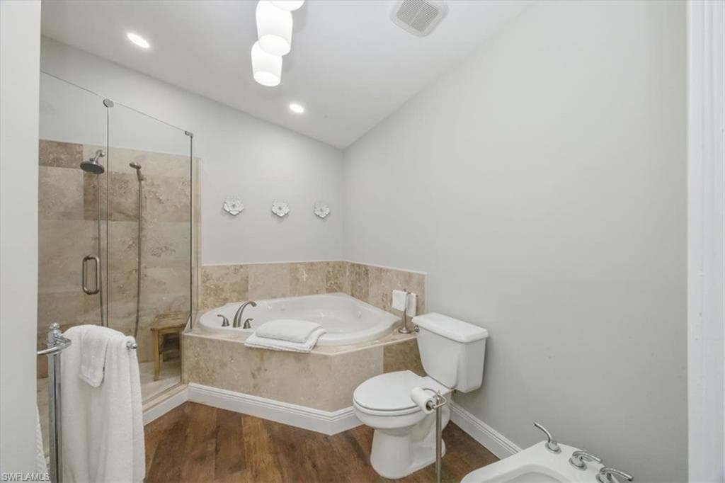 Primary bathroom shower, jetted tub and bidet