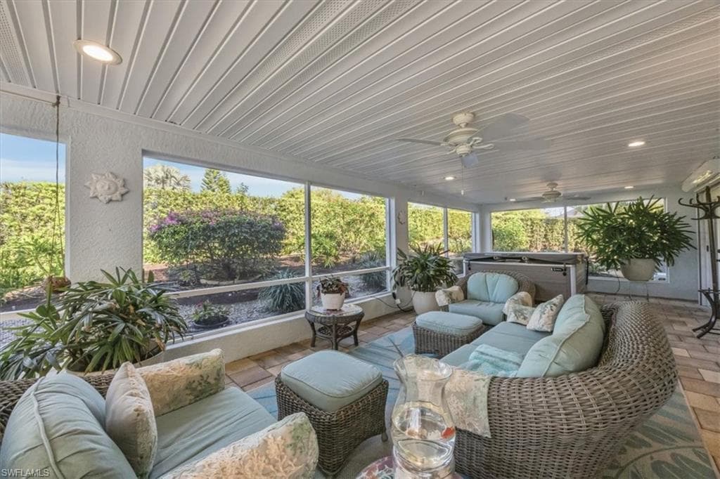 Large screened lanai with newer hot tub view of lush landscaping