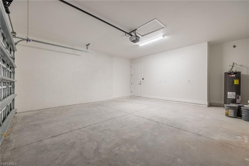 Garage with electric water heater-Finishes may vary