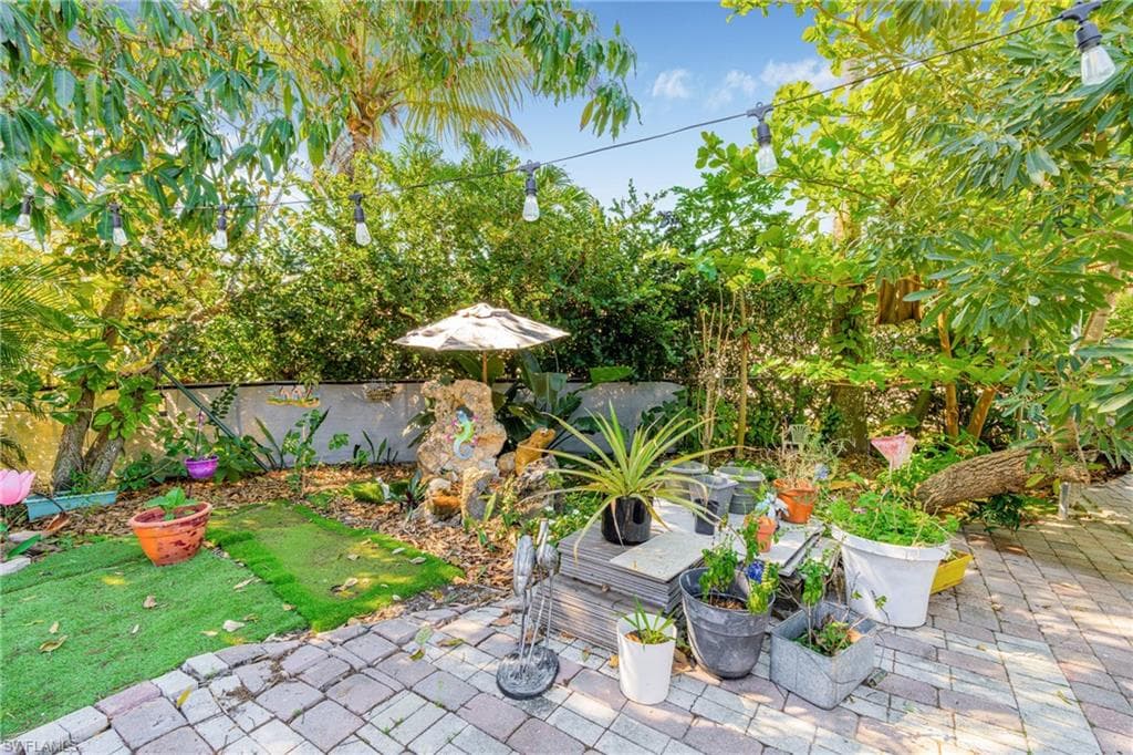 Fenced backyard featuring a patio