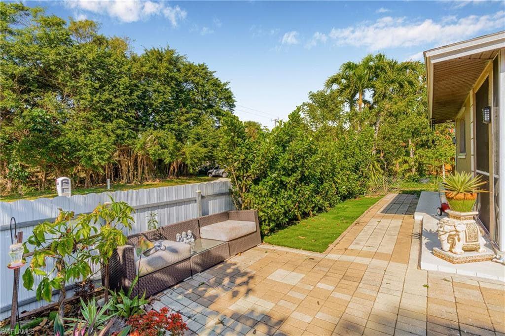 Fenced backyard featuring a patio area and outdoor lounge area