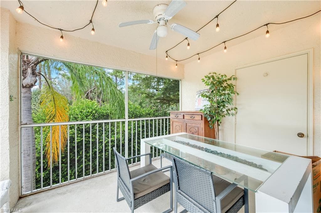Balcony featuring a ceiling fan and outdoor dining area