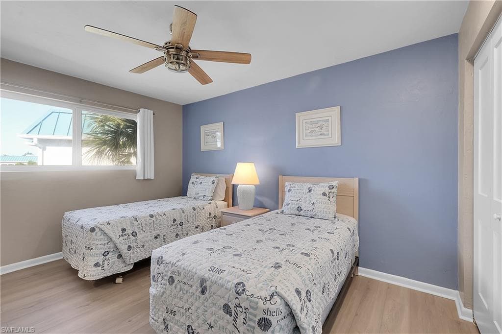 Guest Bedroom with LVP flooring and a large closet.