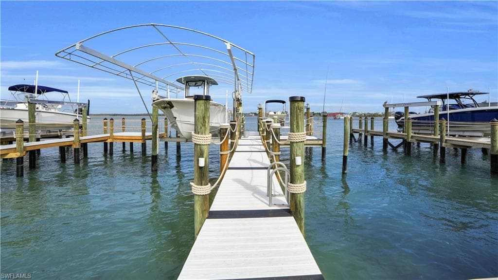 Dock area with a water view and boat lift - Virtually Edited Image