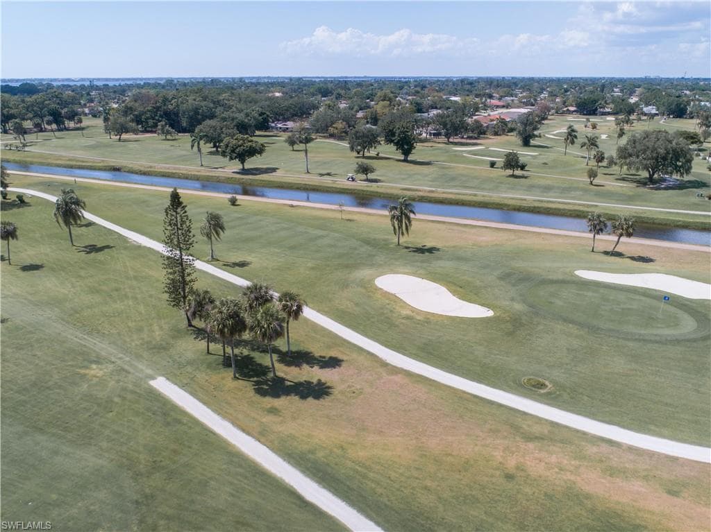 Aerial view of a local golf course and a large body of water