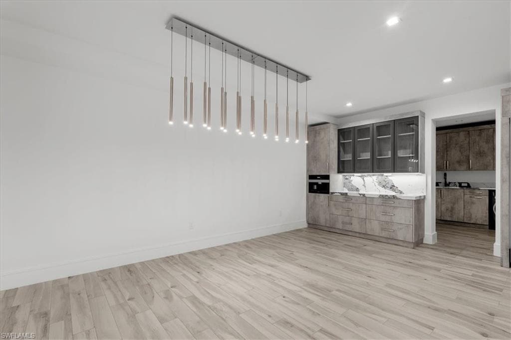 Unfurnished bedroom featuring light wood-style floors and recessed lighting