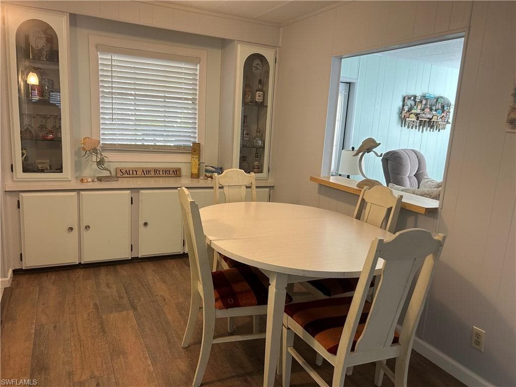 Dining room with dark wood finished floors