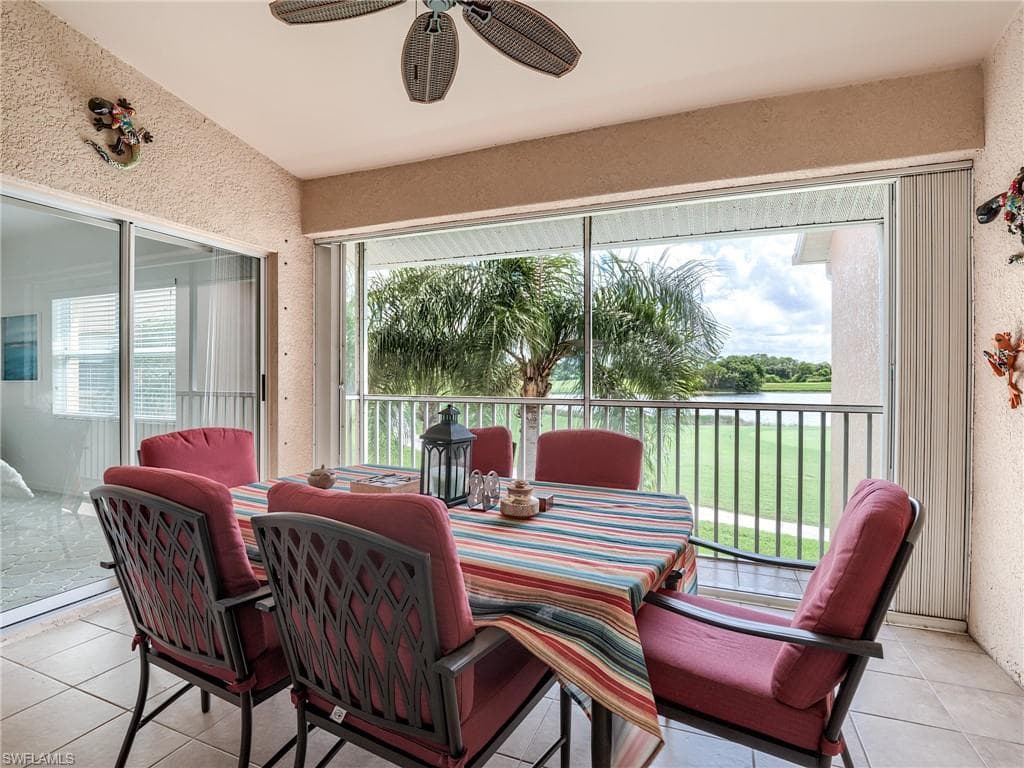 Sunroom with a water view