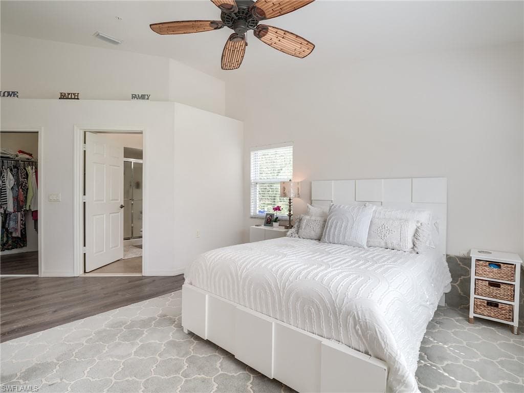 Bedroom featuring ceiling fan and wood finished floors