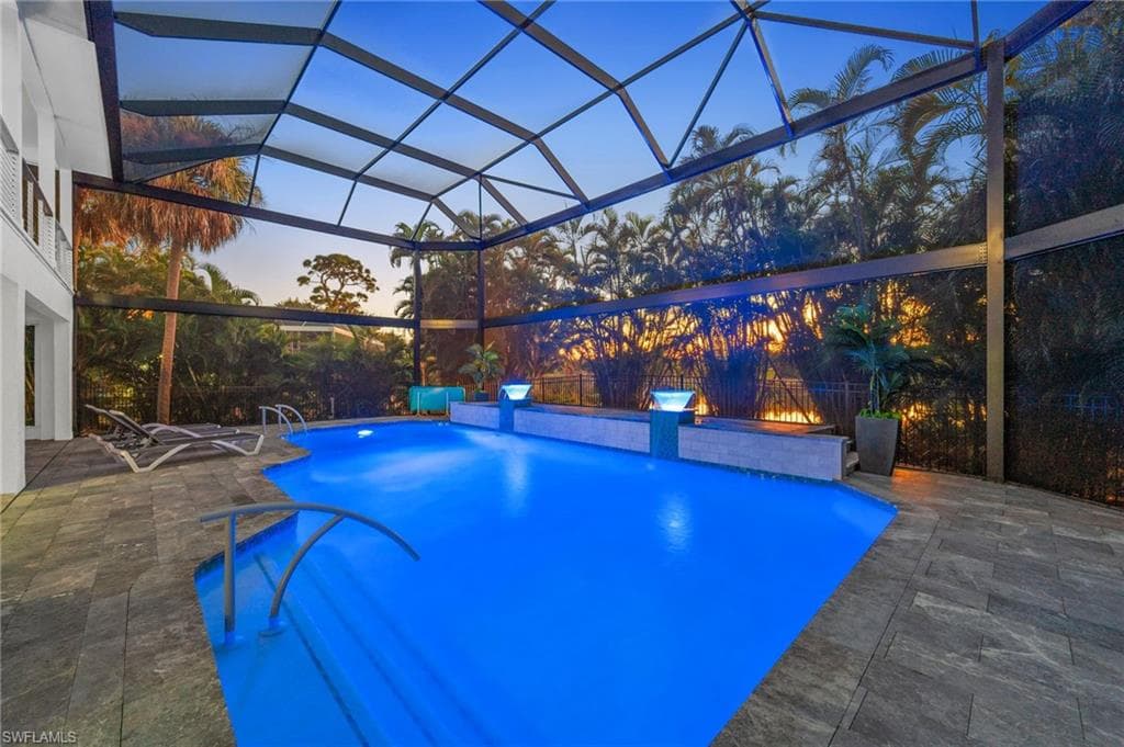Outdoor pool featuring a patio area, beautiful at dusk!!