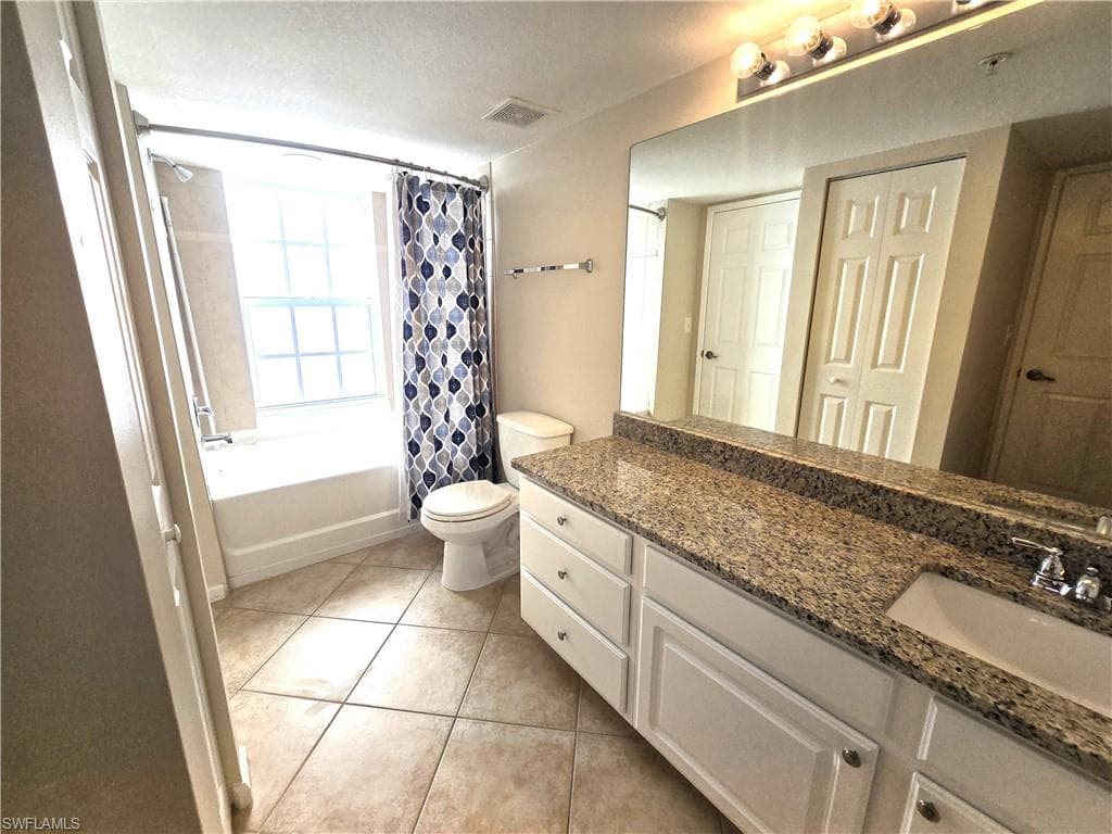 Extra wide vanity with granite, garden tub, linen closet. Impact window.