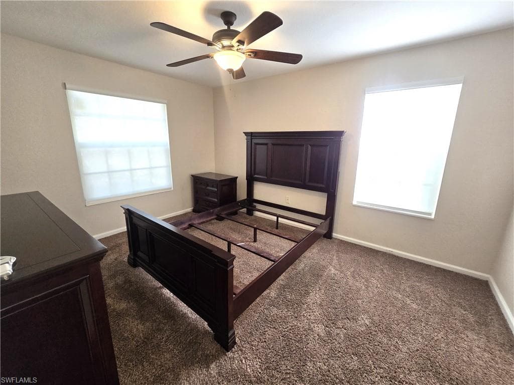 Bed, end table & dresser left for convenience of buyer. Impact windows, electric blinds.