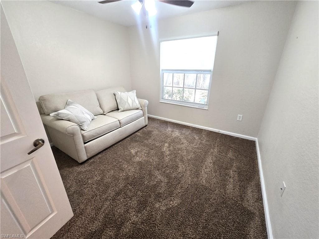 2nd bedroom, carpet, fan w/light. Impact Window.