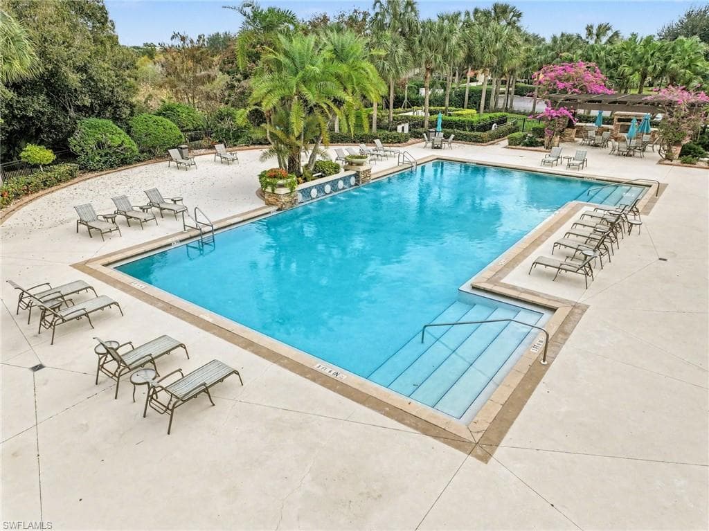 Community pool with a patio area