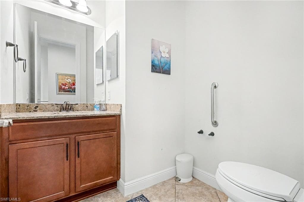 Bathroom featuring vanity and light tile patterned floors
