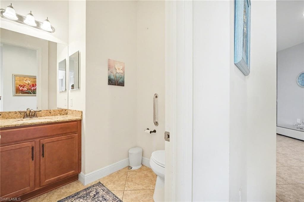 Bathroom with vanity and light tile patterned floors