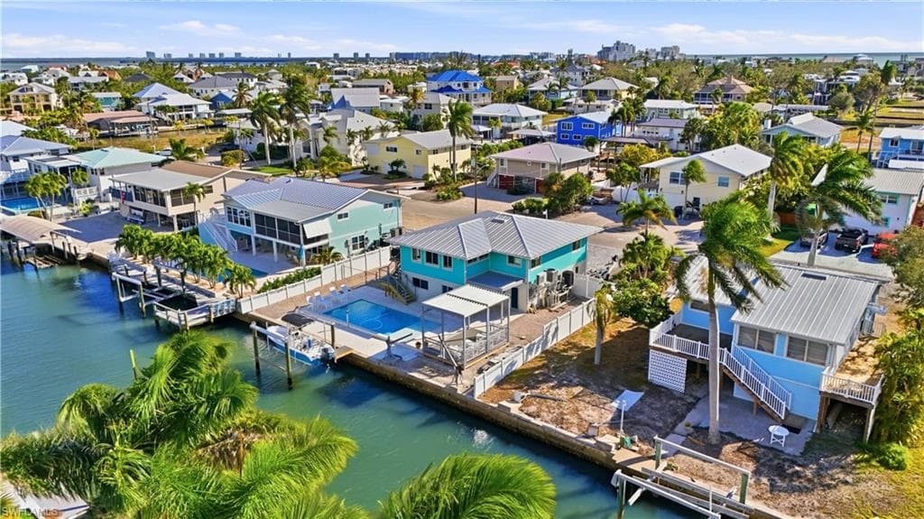 Aerial perspective of suburban area with a nearby bay and Gulf - Virtually Edited Image