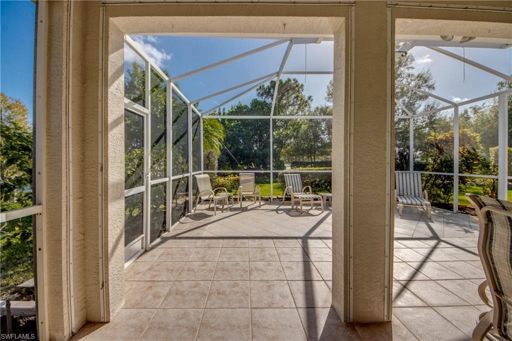 Unfurnished sunroom with a patio area and healthy amount of natural light