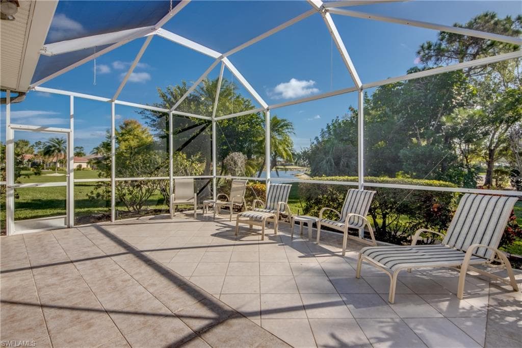 View of patio with a lanai and a sunroom