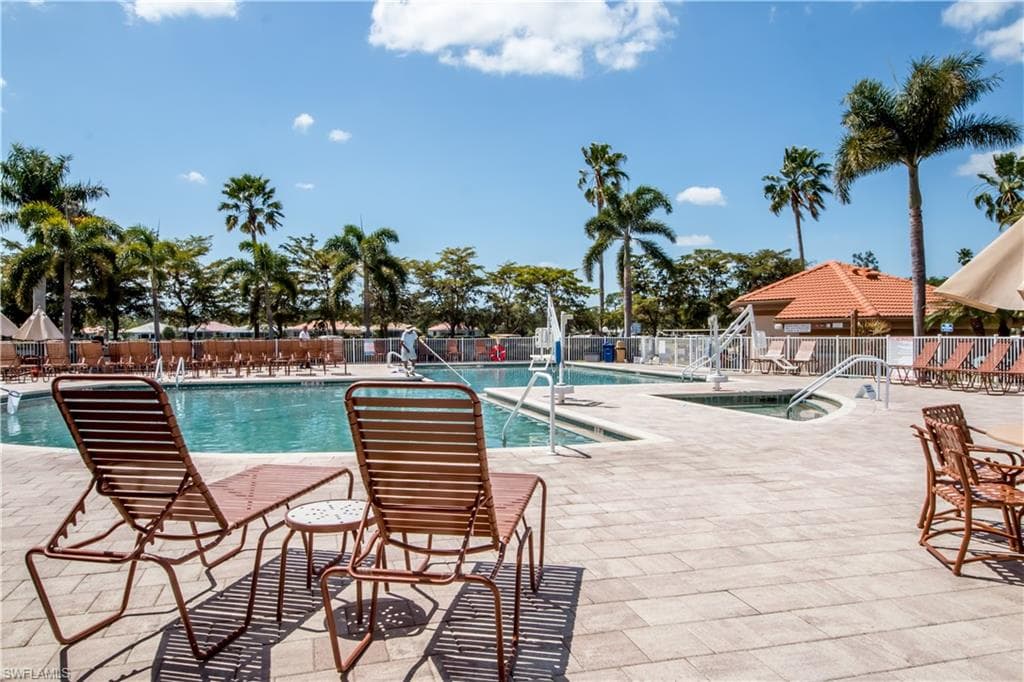 Community pool with a patio