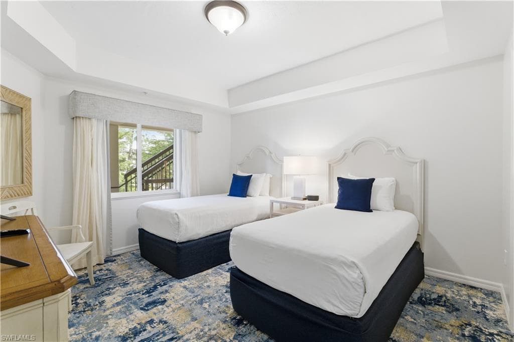 Bedroom with a raised ceiling