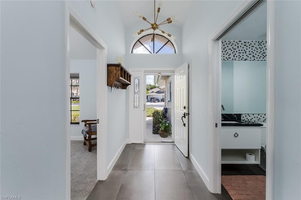Foyer entrance featuring healthy amount of natural light and a high ceiling