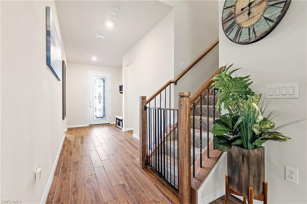 Foyer featuring wood finished floors and recessed lighting