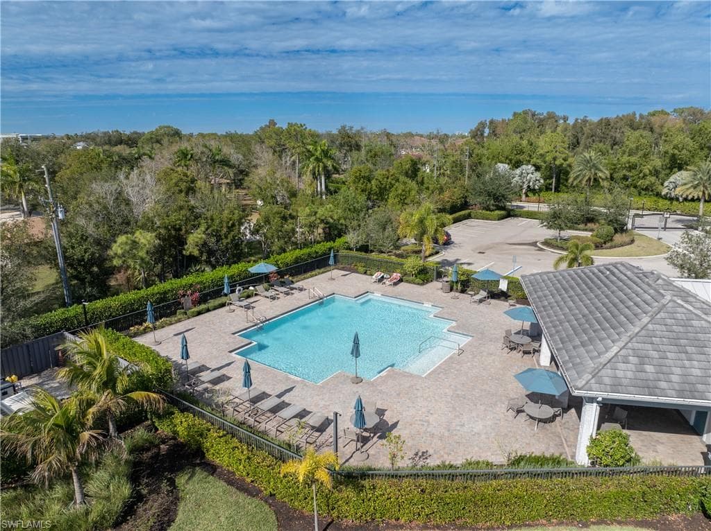 Community pool with a patio area