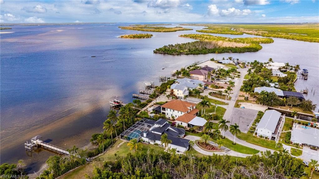 Aerial overview of property's location featuring a large body of water