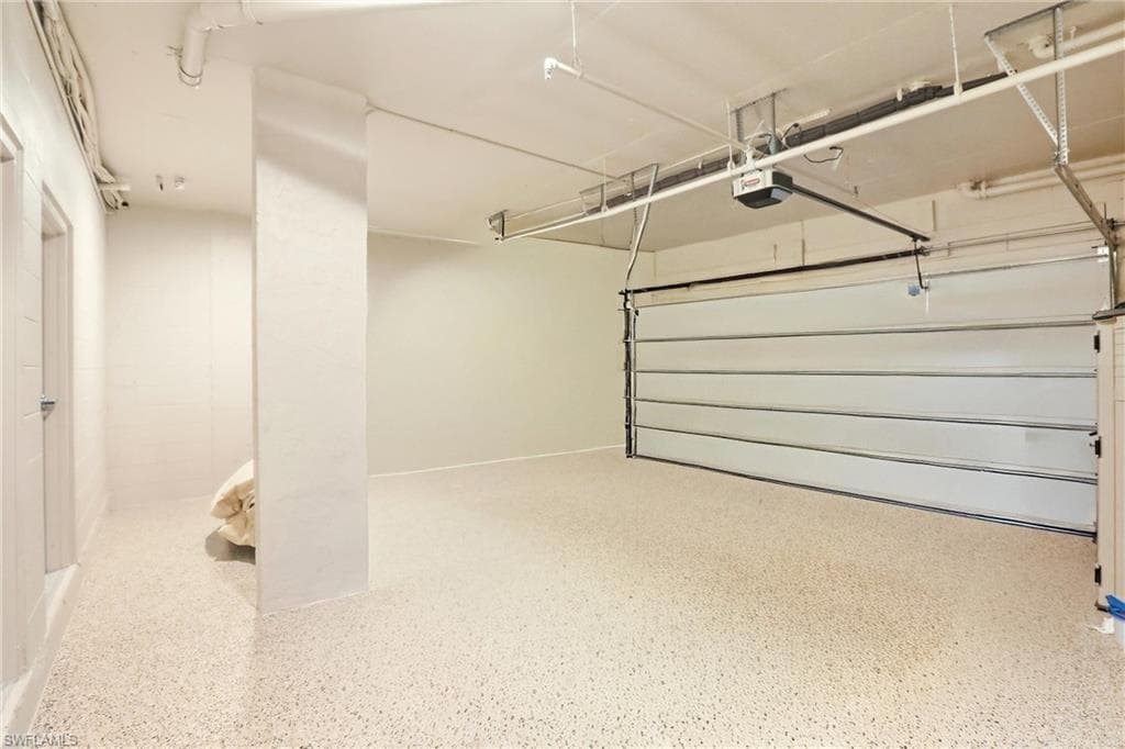 Garage featuring a garage door opener