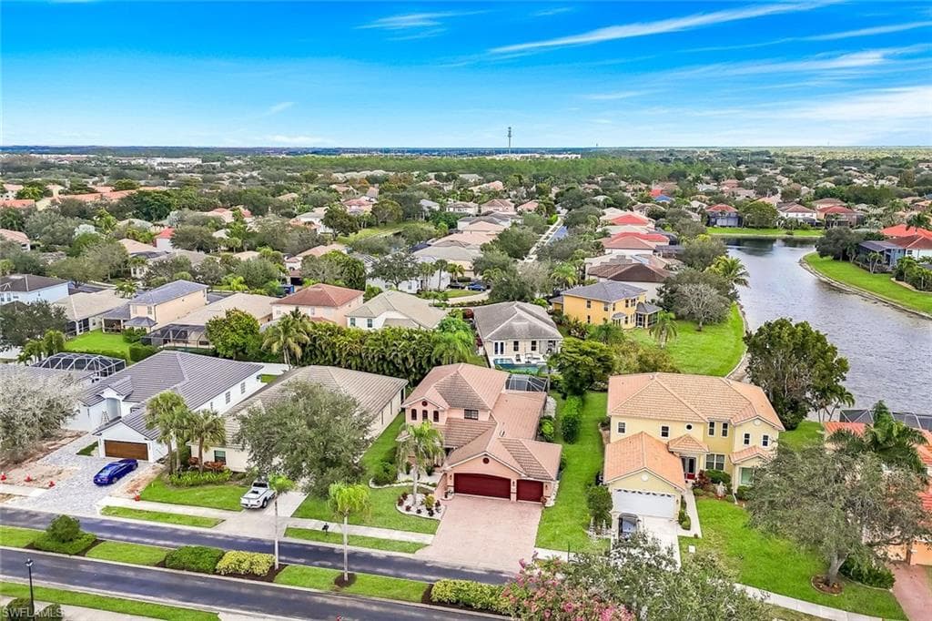 Aerial view of residential area with a nearby body of water