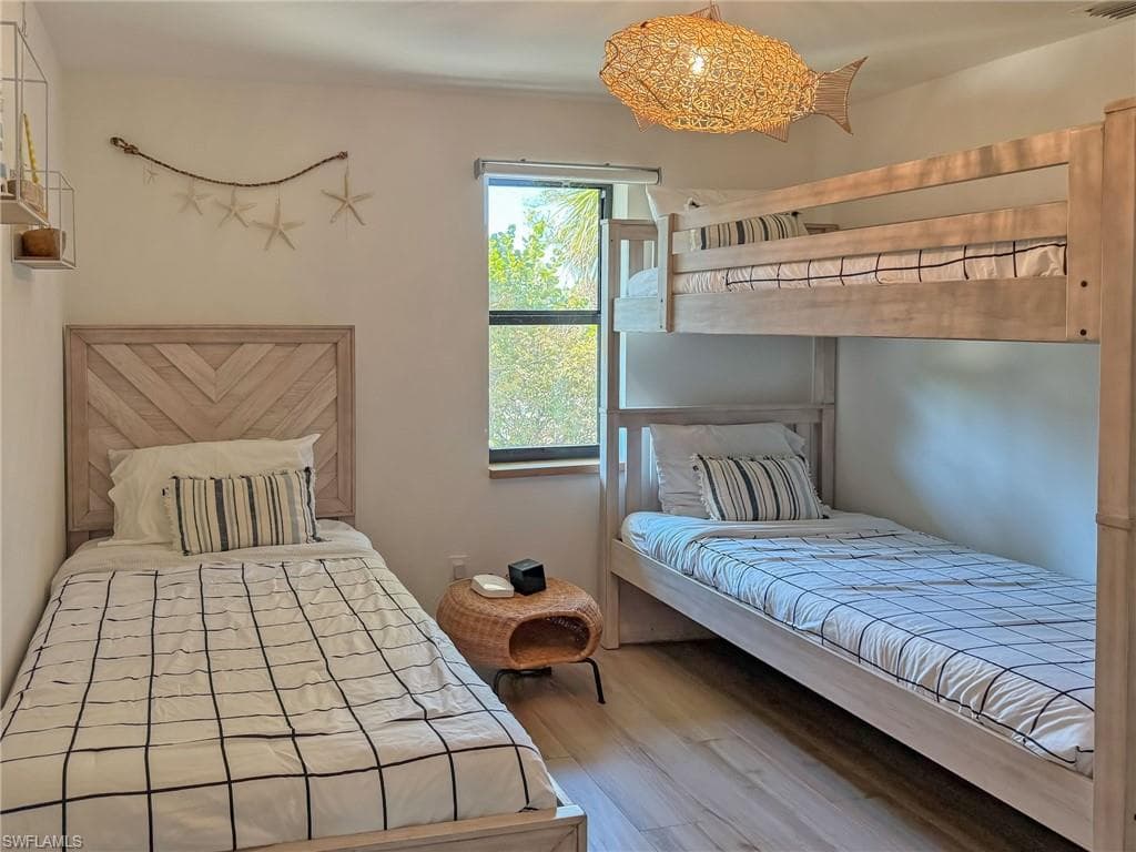 Unfurnished bedroom featuring light hardwood / wood-style floors