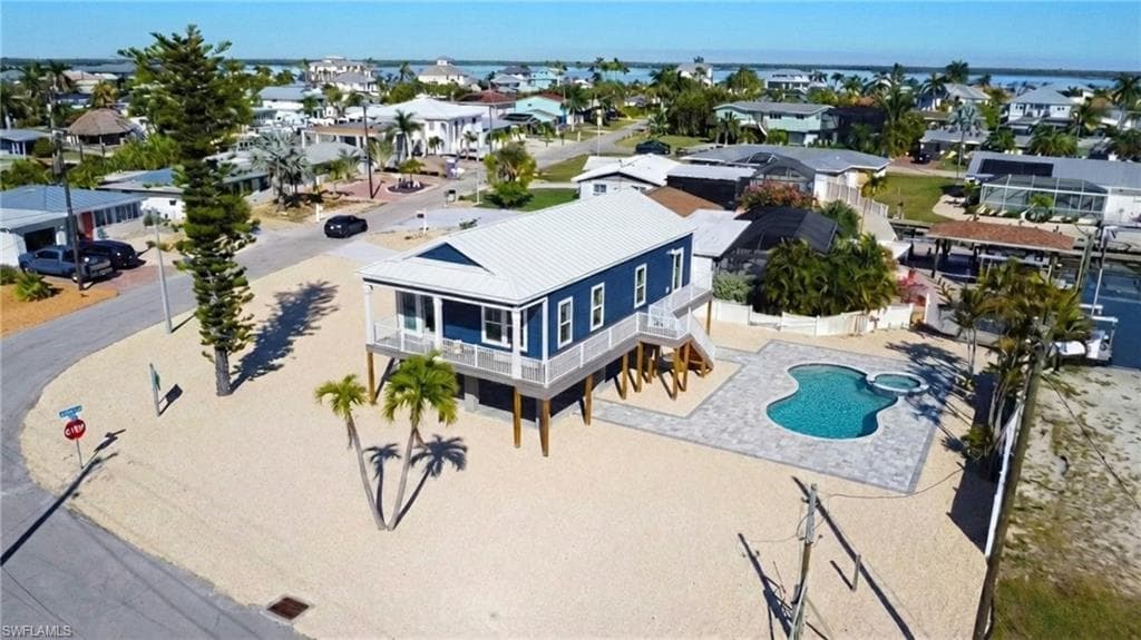 Front view of home with Estero Bay VIRTUALLY EDITED