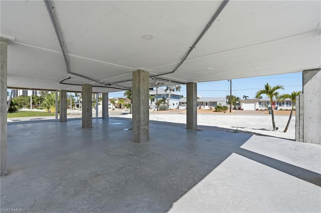 Expansive covered concrete pad with multiple support pillars - Virtually Edited Image