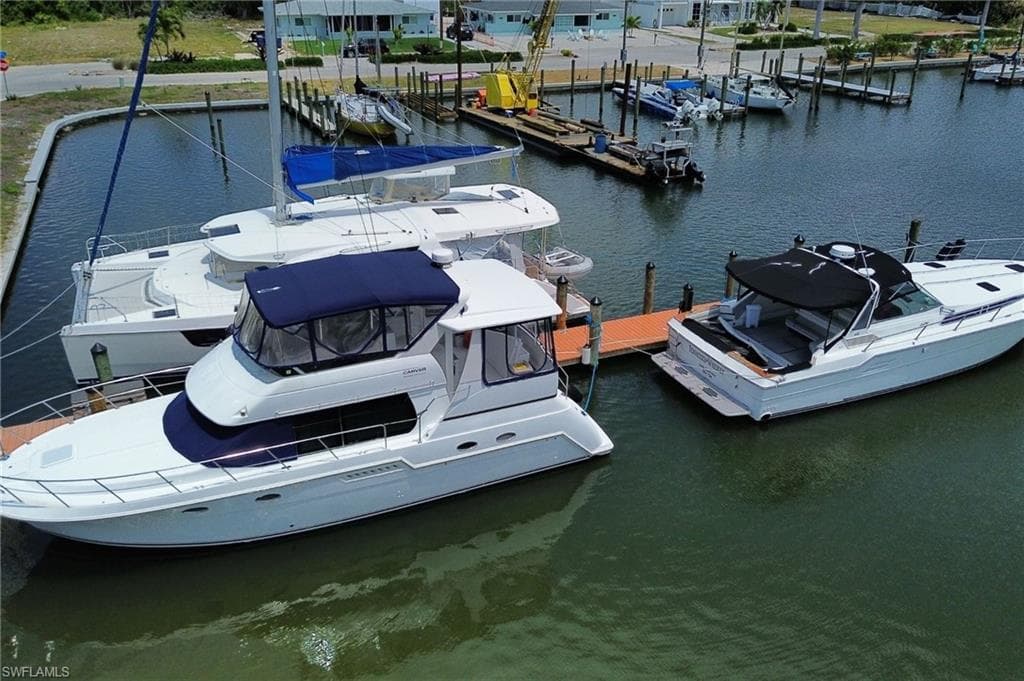 Dock with a water view and view of marina
