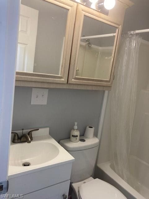 Full bath featuring shower / tub combo and vanity