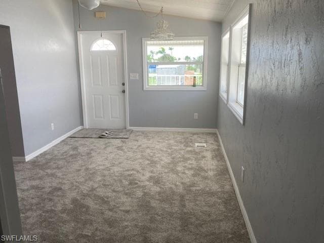 carpet floors and lofted ceiling Living room