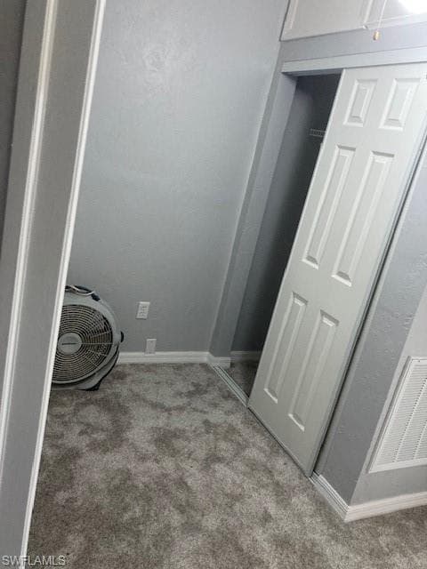 Laundry room featuring light colored carpet