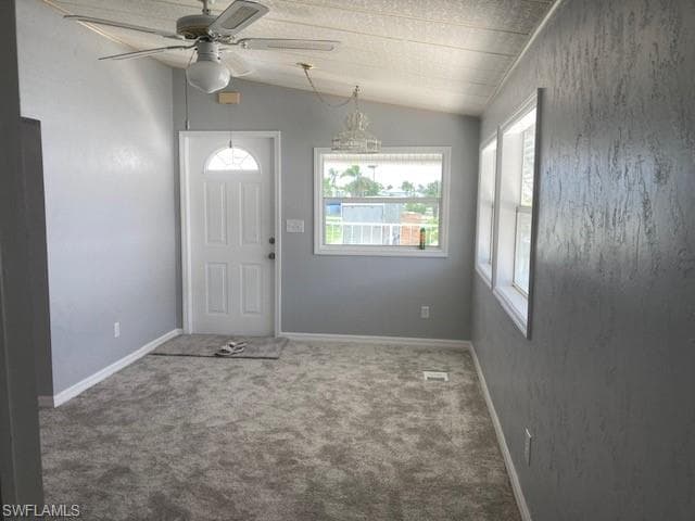 carpet floors, a ceiling fan, and lofted ceiling