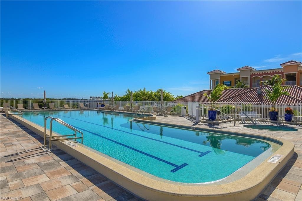 Community pool featuring a patio area