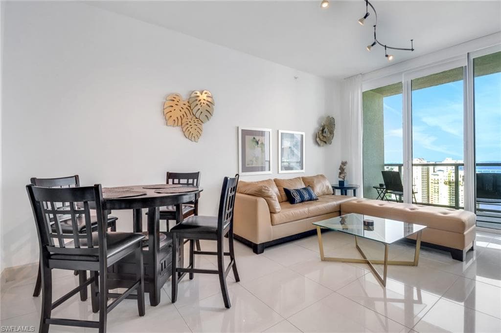 Living room with light tile patterned floors